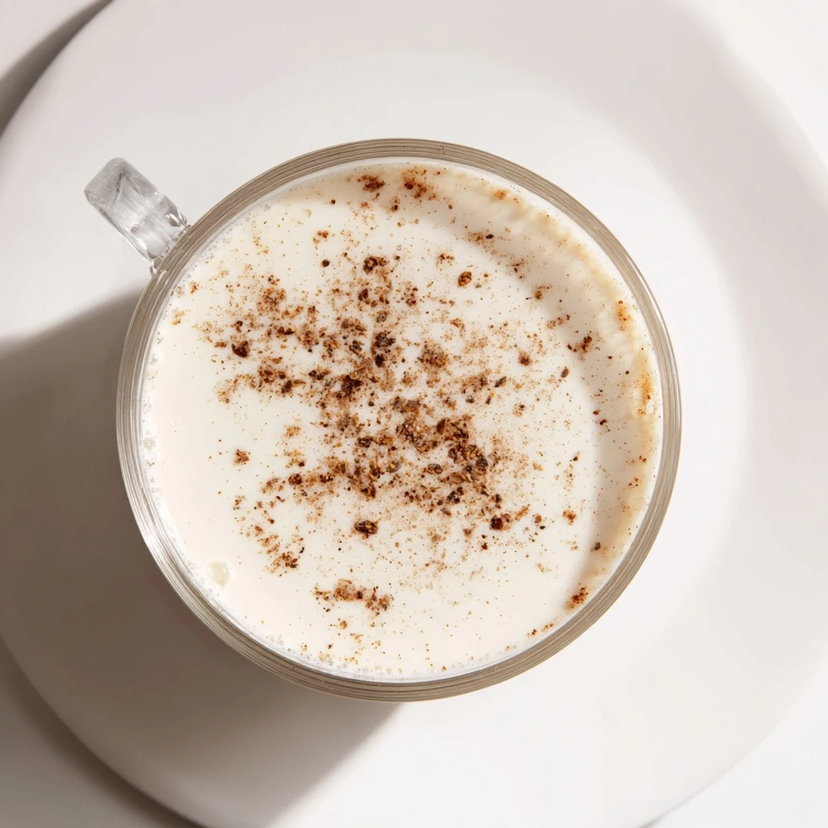 A steaming mug of spiced drink, its warm aroma promising comfort and flavorful spices.