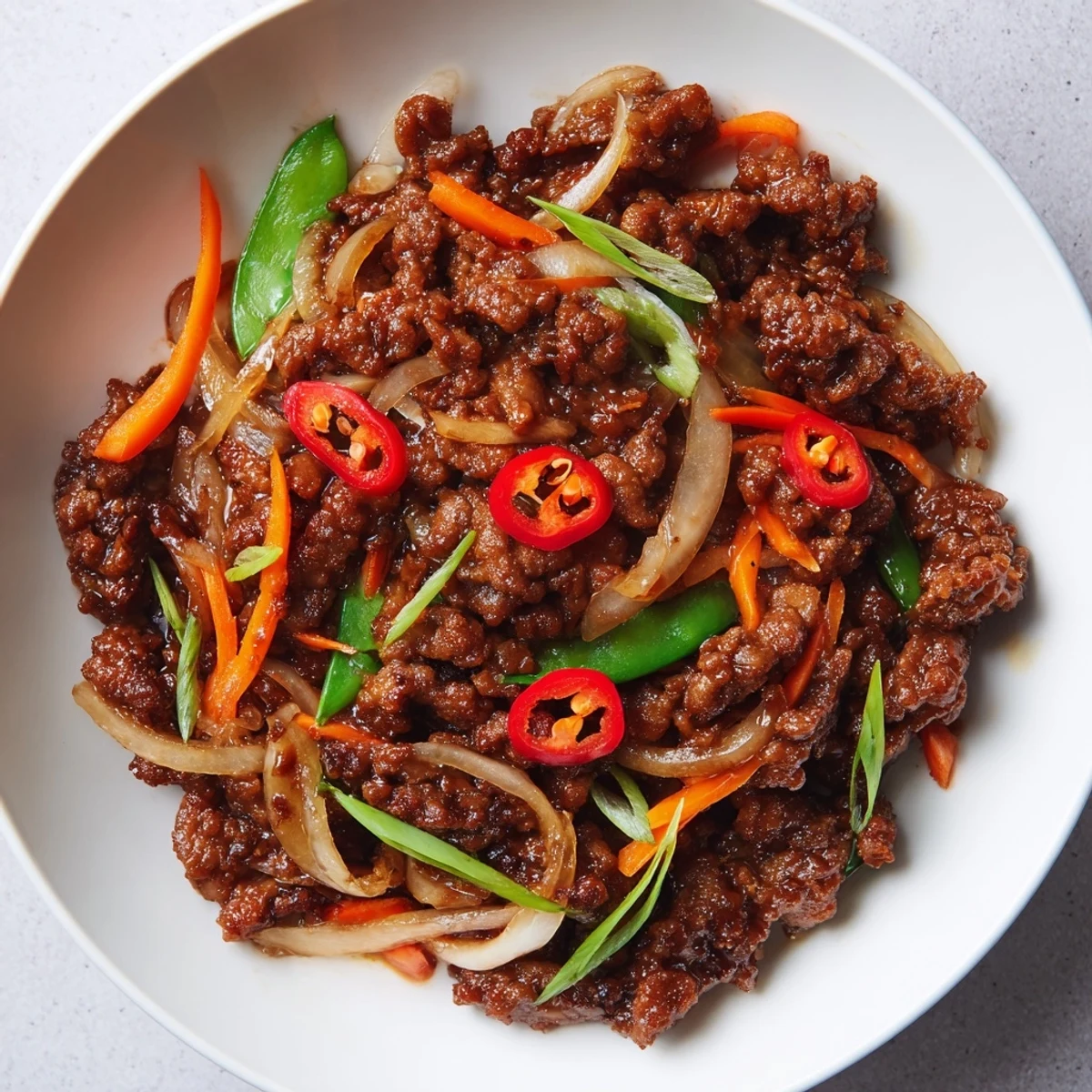 Sizzling Classic Beef Mince Stir-Fry, showcasing tender beef with colorful vegetables and a rich sauce.