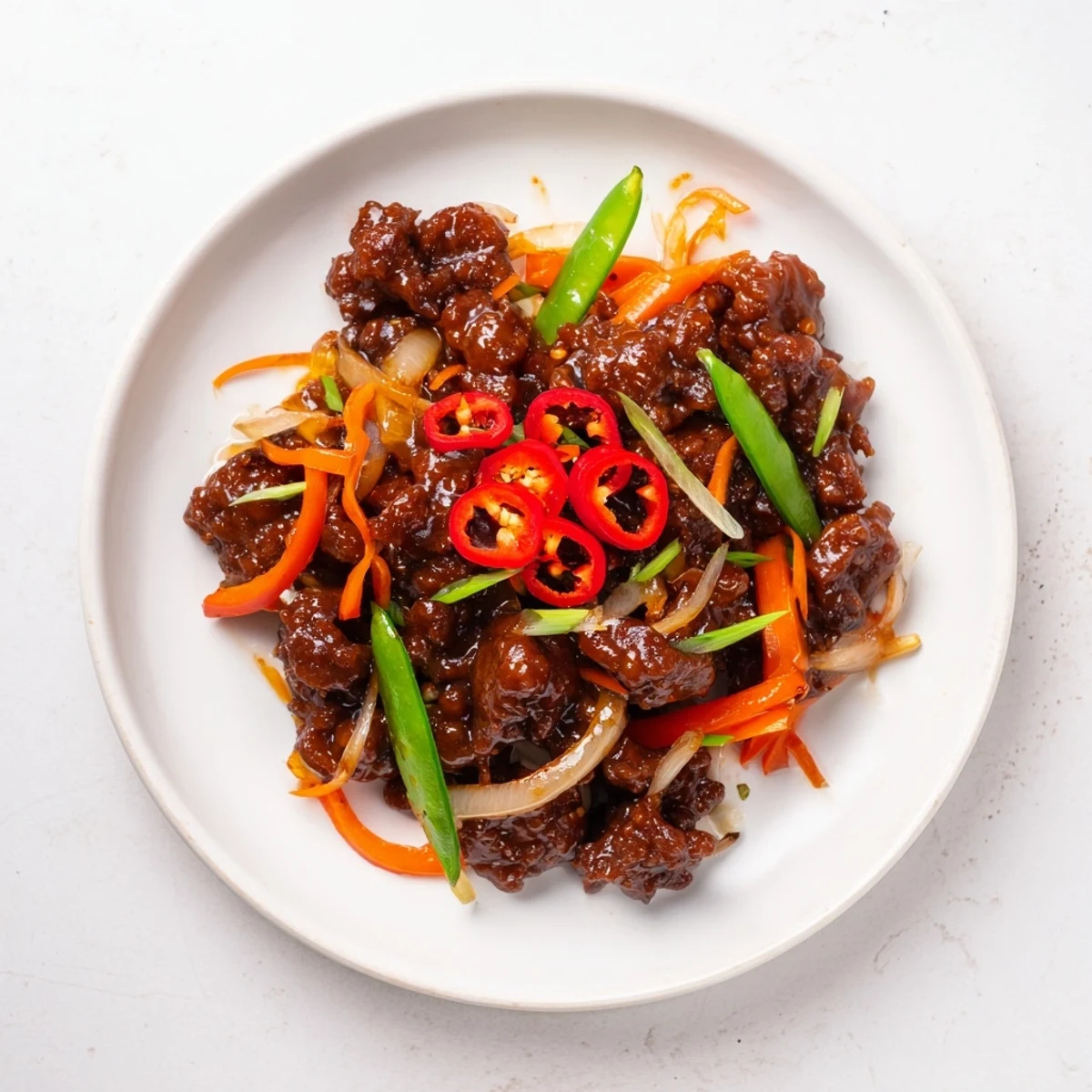 This delicious Classic Beef Mince Stir-Fry photo displays a steaming bowl ready to be enjoyed with rice.