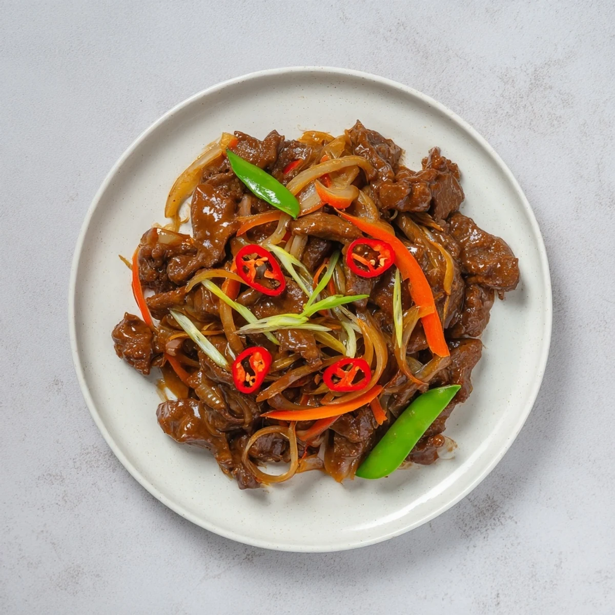 A beautifully plated Classic Beef Mince Stir-Fry, with vibrant vegetable colors in a savory sauce.