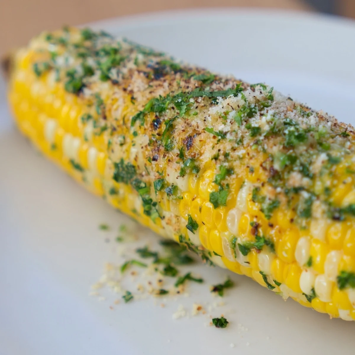 Ears of juicy garlic butter roasted corn, perfectly cooked with a smoky, caramelized finish.