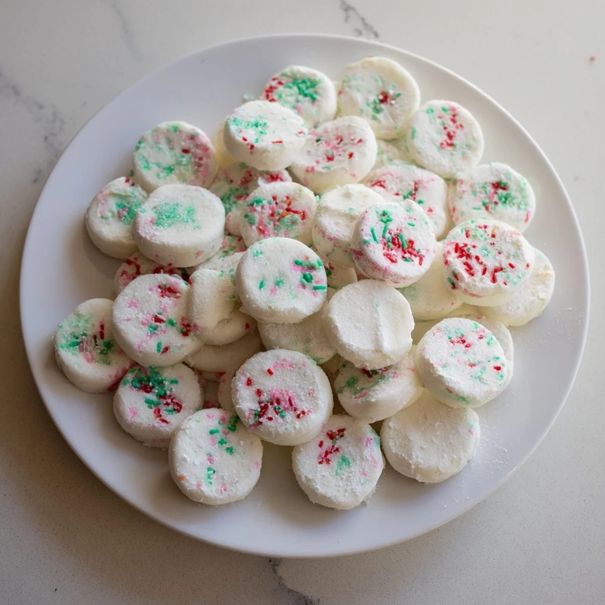 Close-up of fresh, homemade Mint Candy, a soft white confection dusted with powdered sugar.