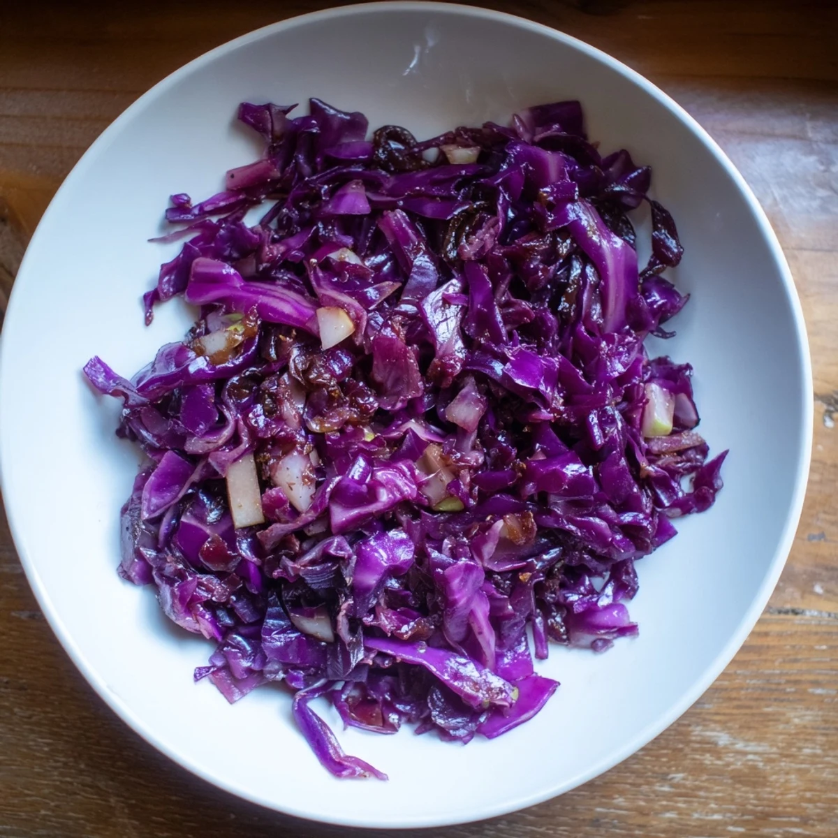 A delicious bowl of Braised Red Cabbage with spices, smelling of cinnamon and tangy vinegar.