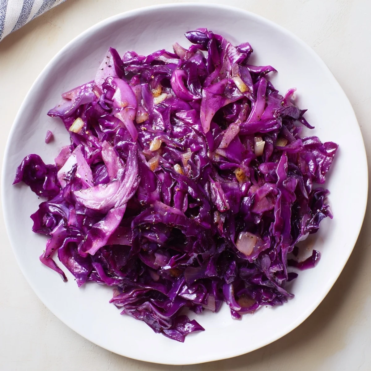 Steaming Braised Red Cabbage with spices, a vibrant side dish ready to serve alongside a roast.