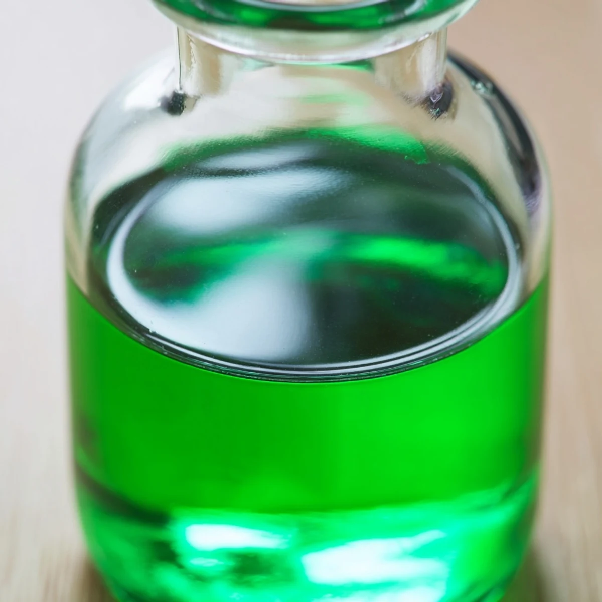 Close-up of clear peppermint extract in a bottle, ready to add minty flavor to your recipes.