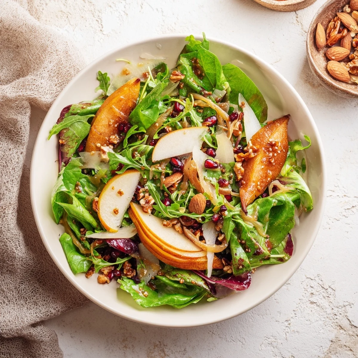 This Winter Green Salad features glistening pears and toasted walnuts with vibrant greens, ready to eat!