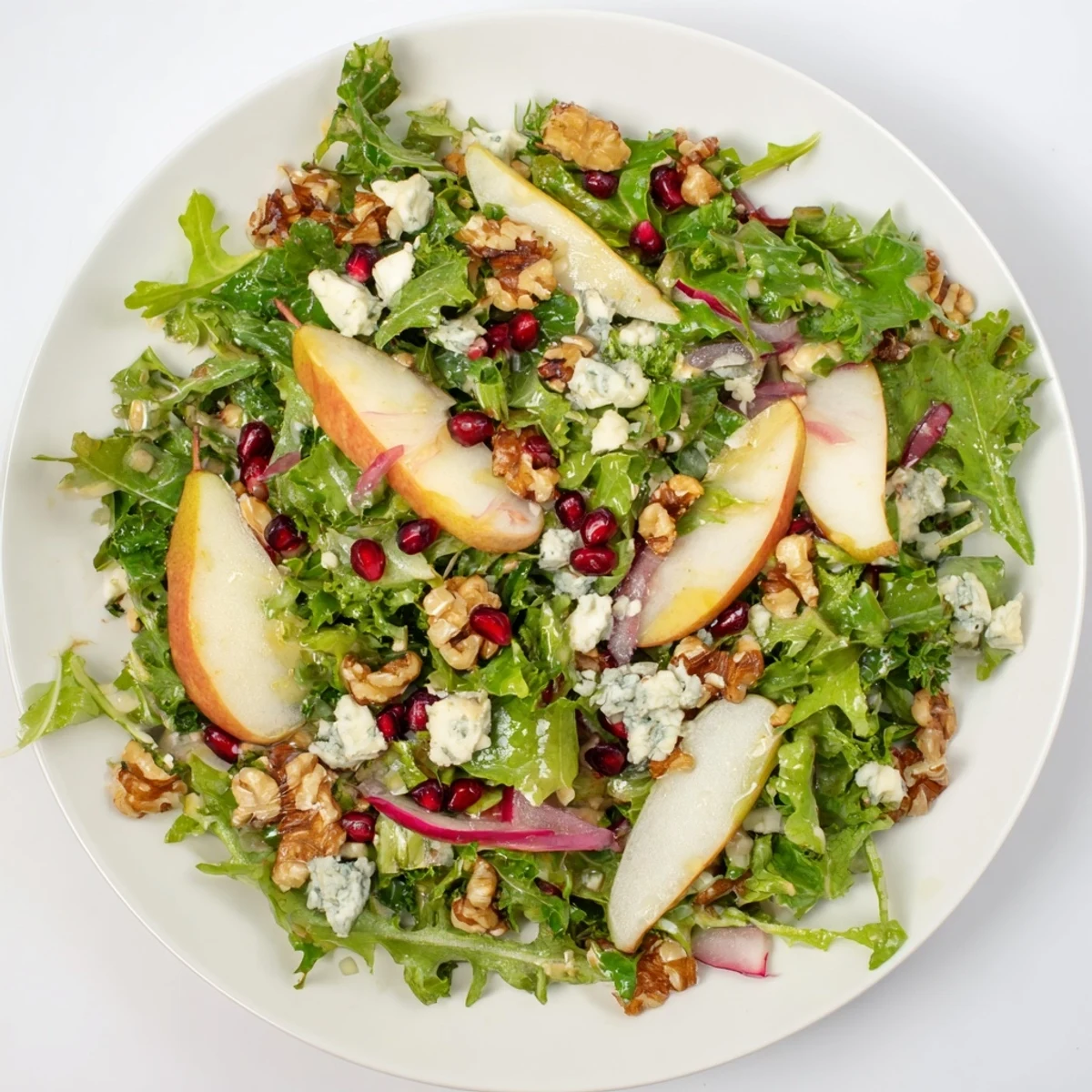 Close-up of a colorful Winter Green Salad served, showcasing the crisp textures and fresh flavors.