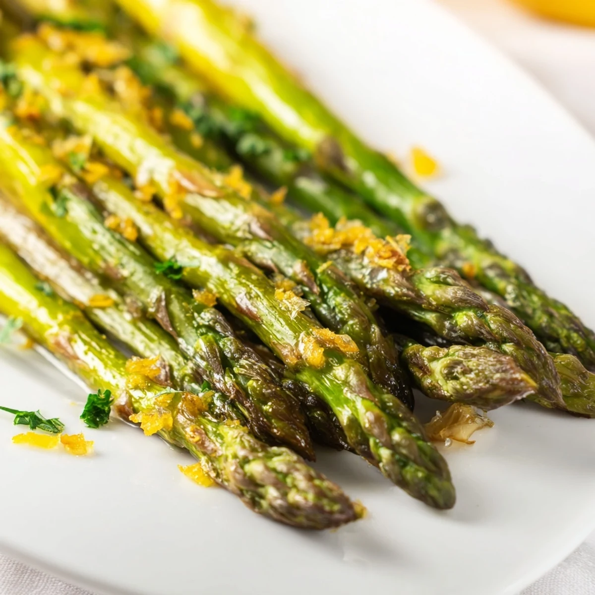 Tender Lemon Garlic Roasted Asparagus on a baking sheet, golden edges and glistening with olive oil, ready to serve warm.
