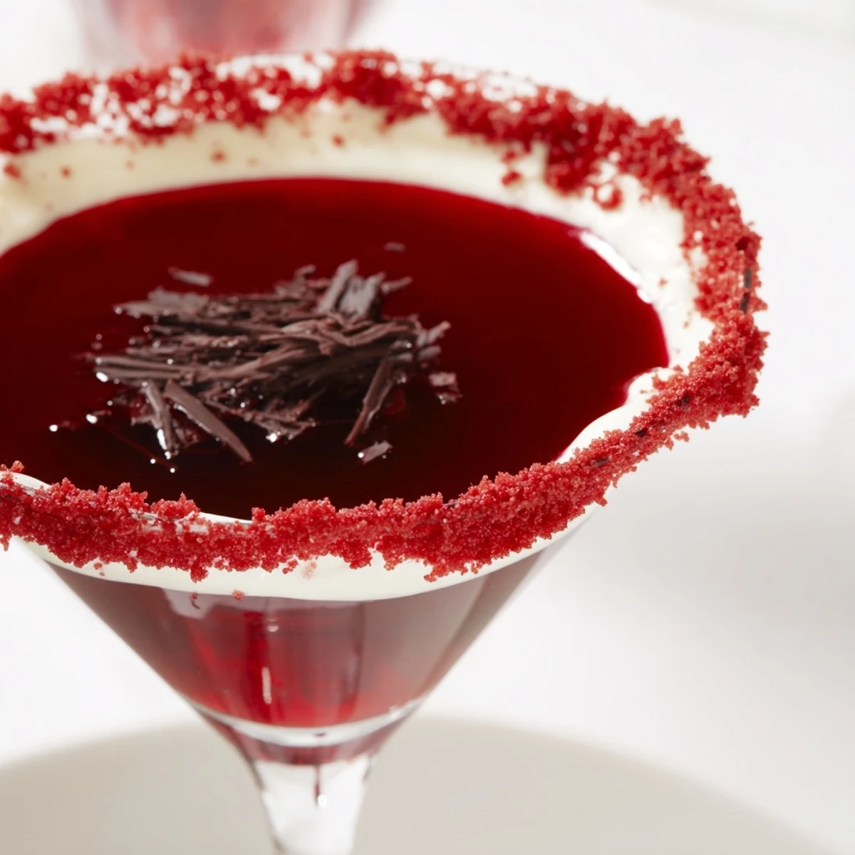 The creamy Decadent Red Velvet Martini glows ruby red with ice and a rich, dessert-like aroma.