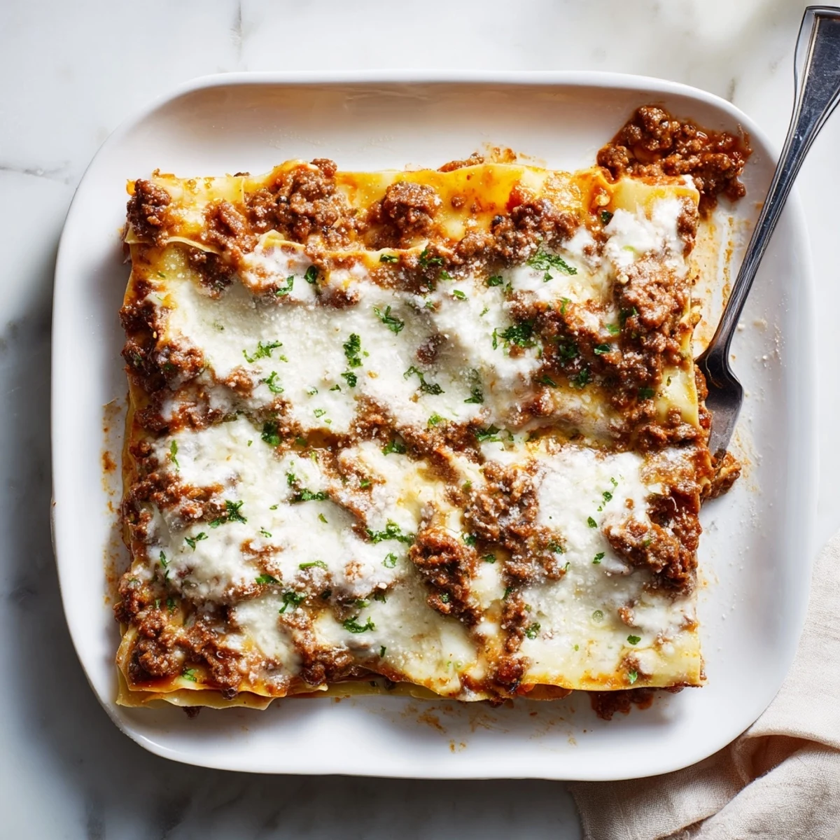 Golden brown Classic Beef Lasagne with bubbling mozzarella and rich meaty layers