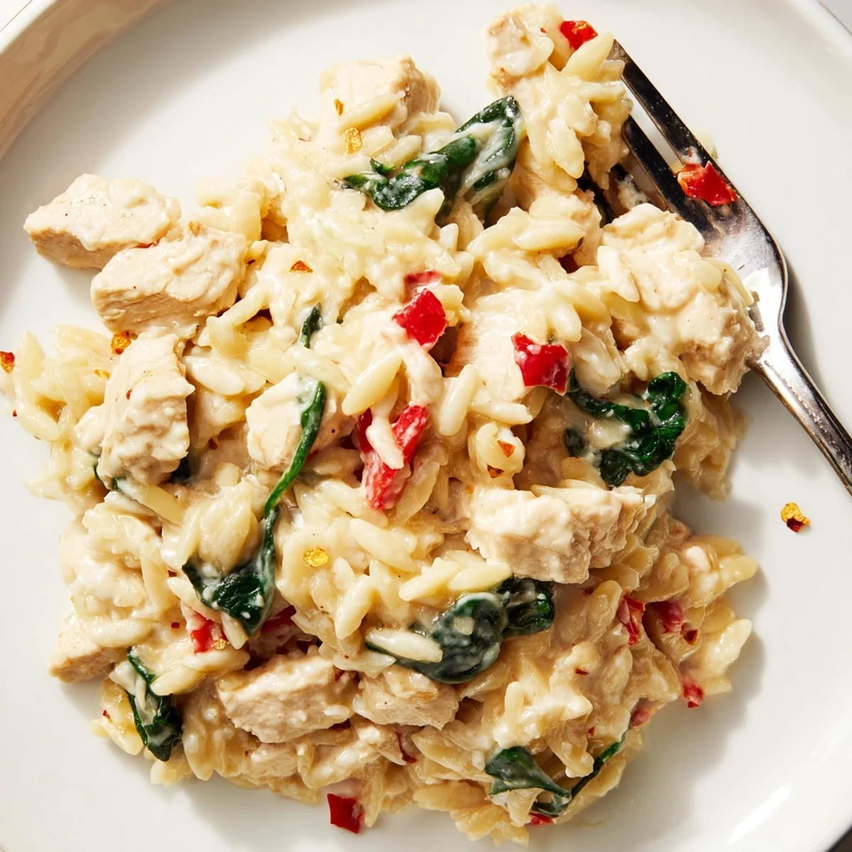 Creamy 30 minute cheesy chicken risoni skillet with melted mozzarella and tender diced chicken