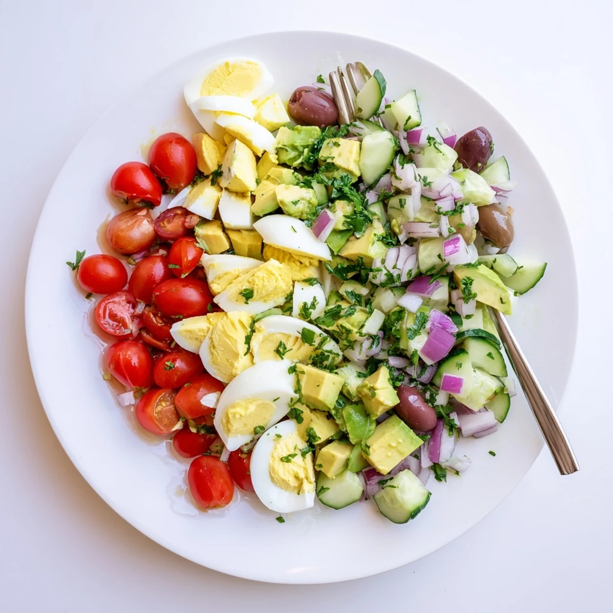 Creamy Mediterranean avocado egg salad served in a white bowl with fresh parsley garnish