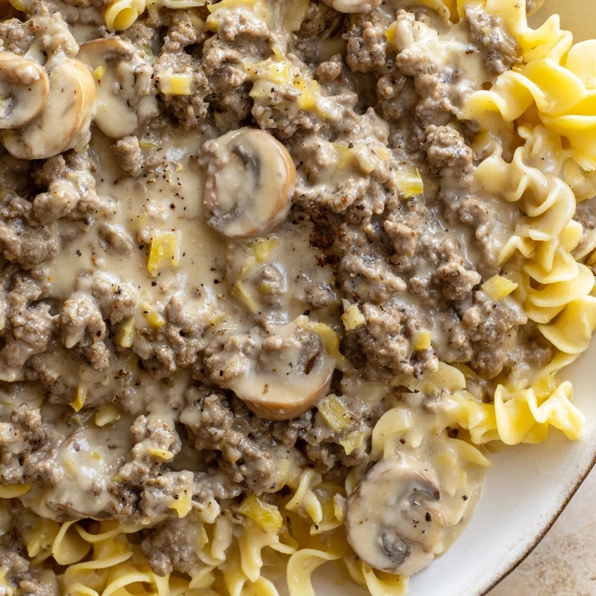 Hearty hamburger stroganoff in rich sour cream sauce garnished with fresh parsley
