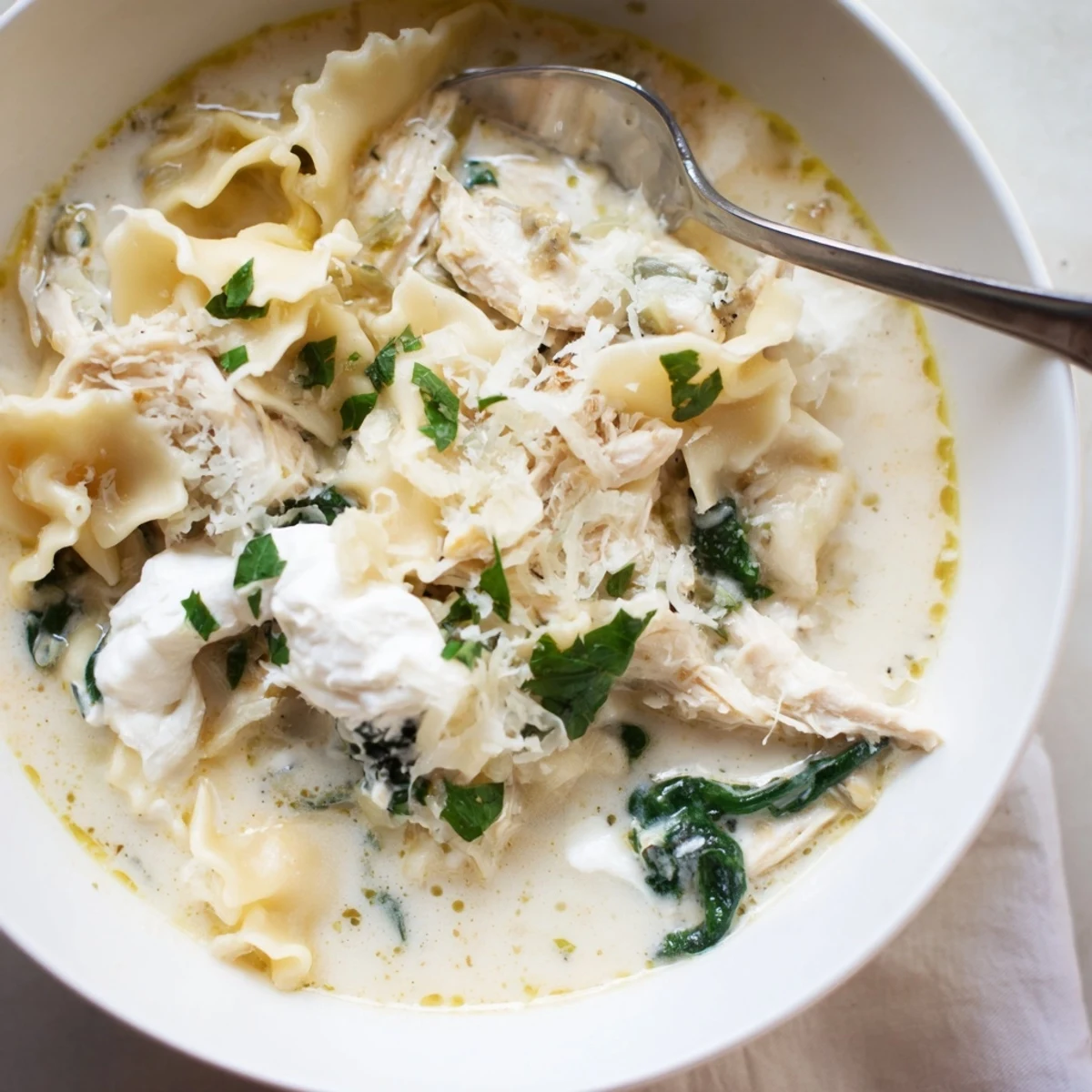 Homemade white lasagna soup loaded with ricotta, chicken, and al dente pasta pieces