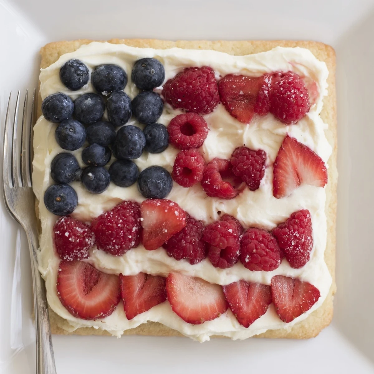 Serve Sugar Cookie Flag Fruit Pizza sliced with sparkling lemonade for summer gatherings.