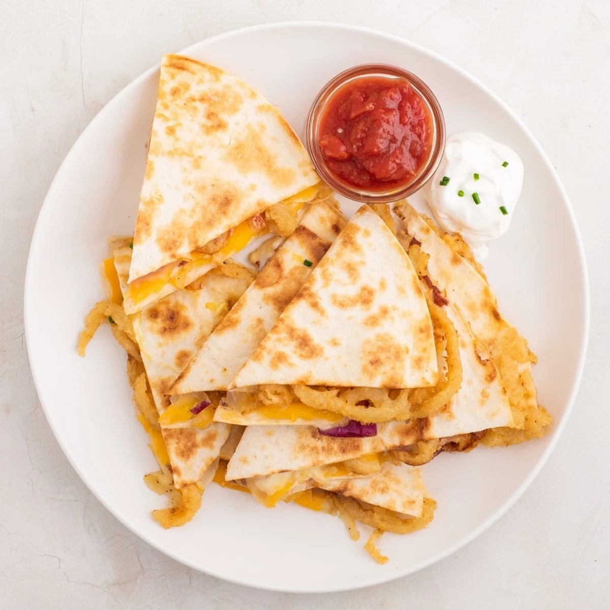 Sizzling onion ring chips quesadillas folded into flour tortillas with oozy cheesy goodness