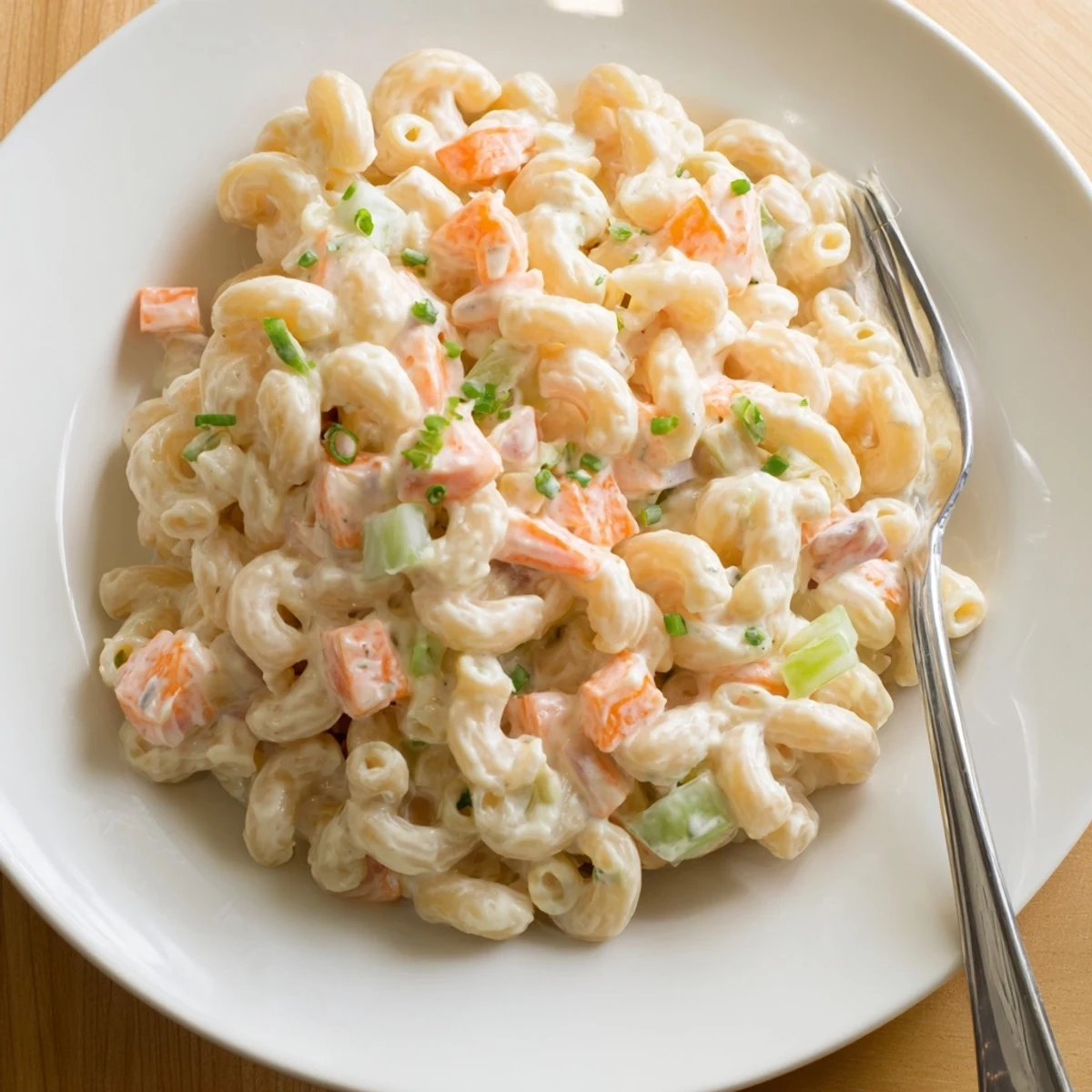 Creamy Hawaiian style mac salad featuring tender macaroni tossed in tangy mayonnaise dressing with grated carrots and celery.
