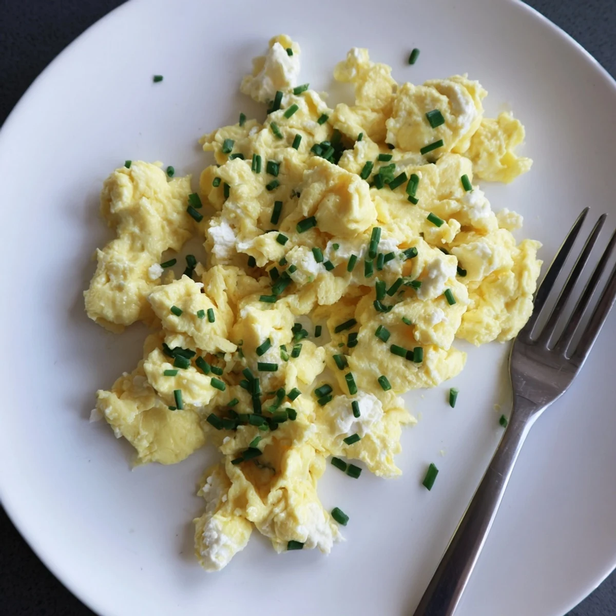 Cottage Cheese Scrambled Eggs With Chives, fluffy creaminess steaming on buttered toast