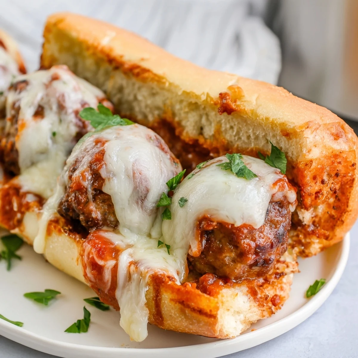 Golden toasted sub roll piled high with three tender meatballs smothered in rich red marinara sauce and melted mozzarella cheese