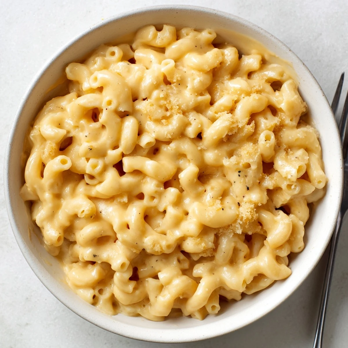 Rich, velvety Mac And Cheese served hot with tangy Dijon and pepper